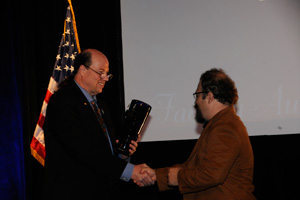 Pictured is Levent Yilmaz receiving the External Consulting Award.
