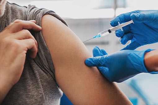 Vaccine injected into an arm