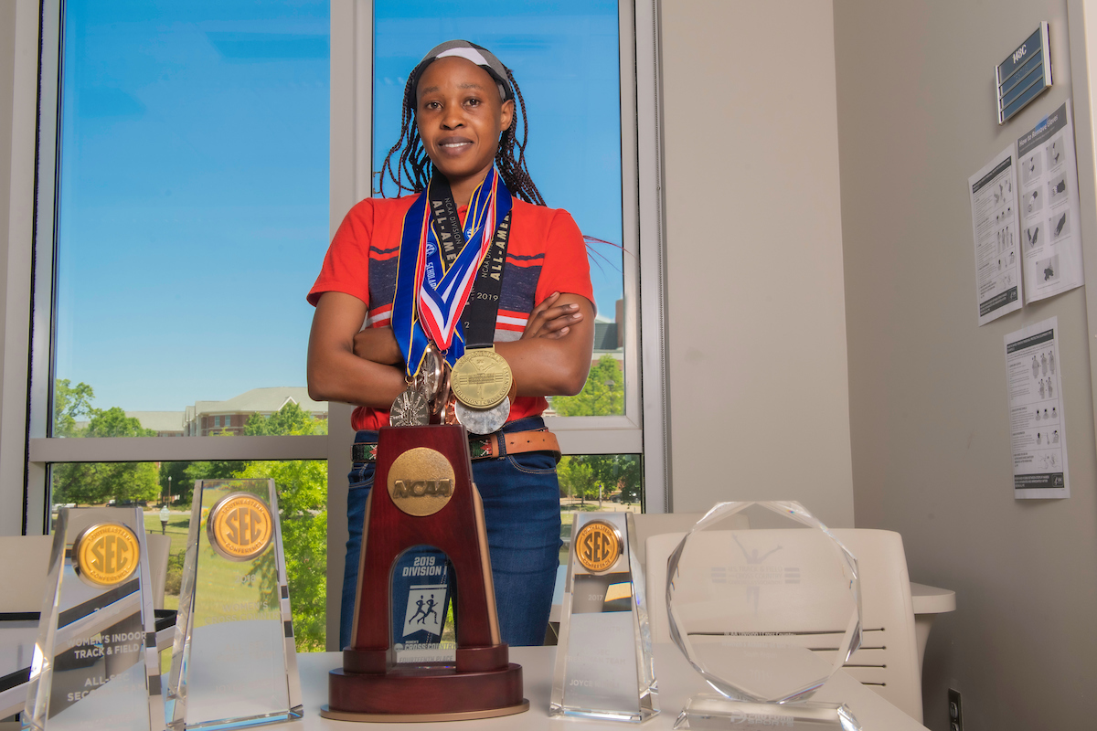 Joyce Kimeli with some of her medals and trophies.
