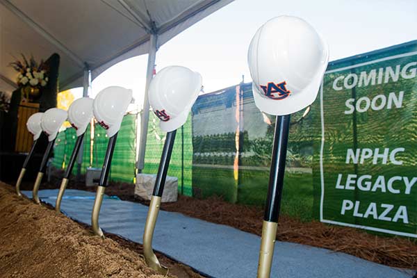 Several hard hats at a ground breaking ceremony