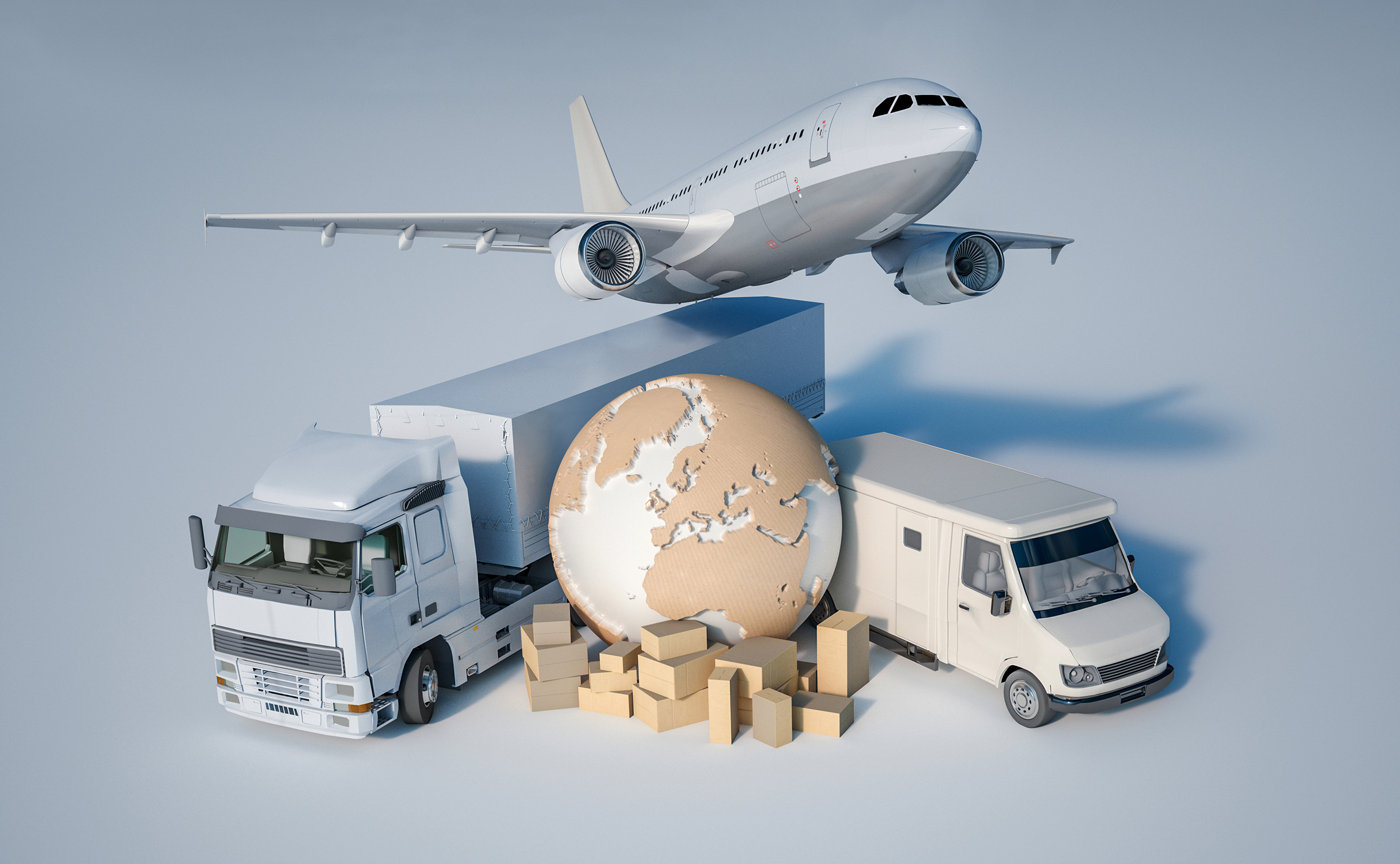 Photograph showing a globe, jet, two trucks and packages.