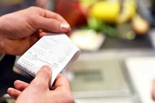 Hand holding a receipt