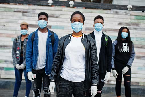 a group of African-American teenagers wearing medical masks