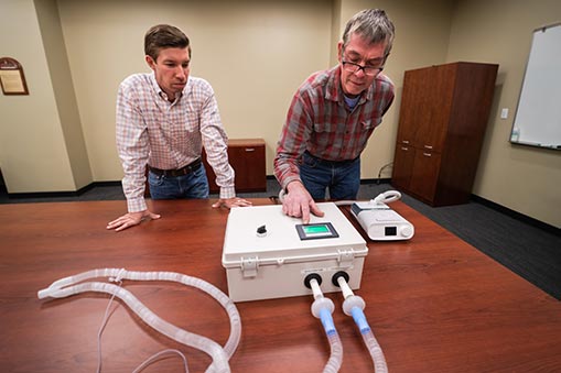 Michael Zabala and Tom Birch examine a new medical accessory