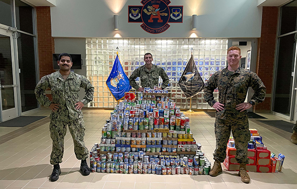 Naval ROTC members standing with their BBFD food items