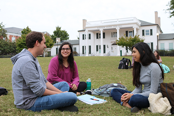 Students talk on campus at Auburn.