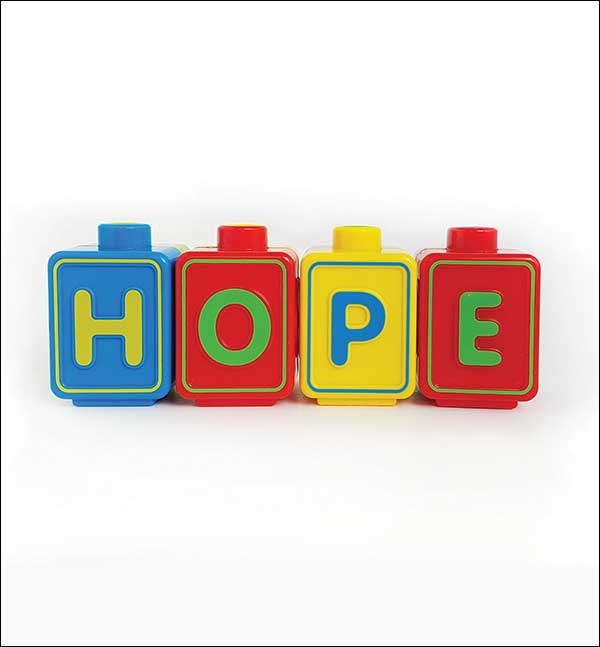 The word HOPE is spelled with childrens blocks