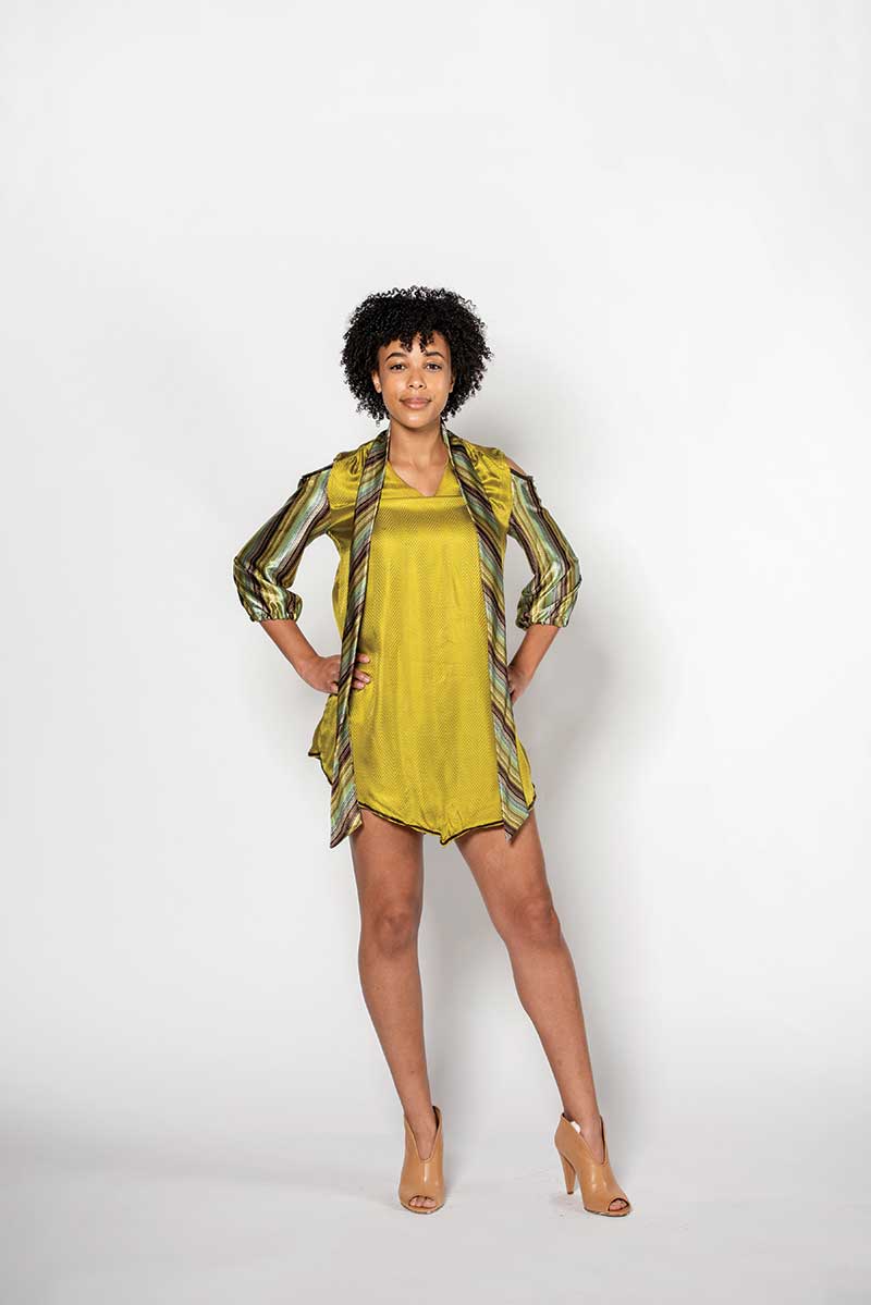 A model in a yellow dress poses