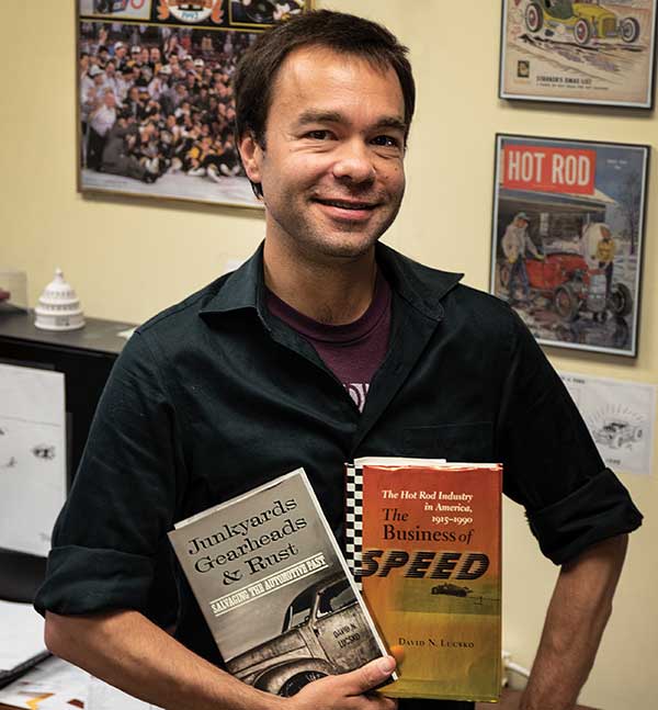 David Lucsko poses with two books.